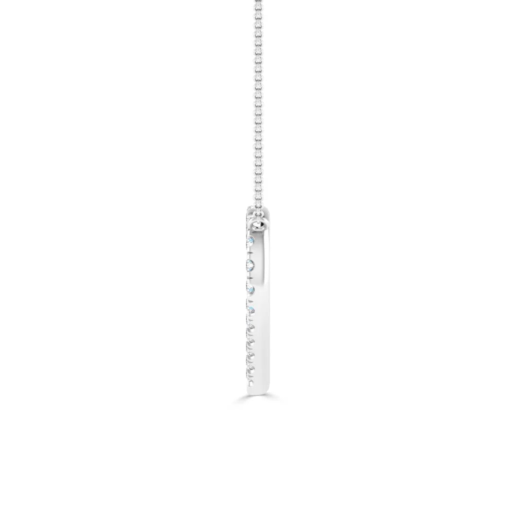 A vertical silver bar pendant necklace with embedded small round gemstones on a delicate chain, white background.