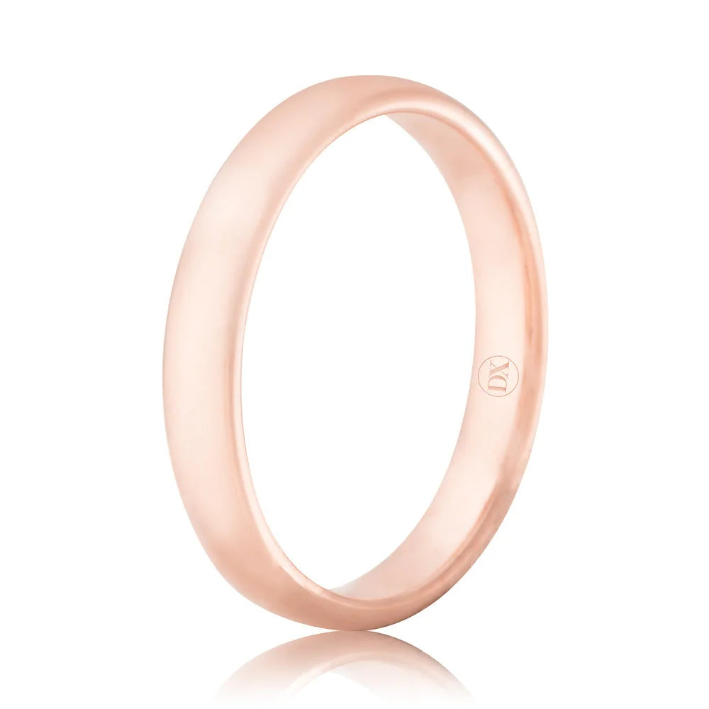 A simple, polished rose gold wedding band with a smooth surface, shown against a white background.