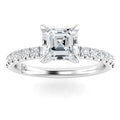 A platinum ring with an Asscher-cut center diamond and round diamonds set along the band.