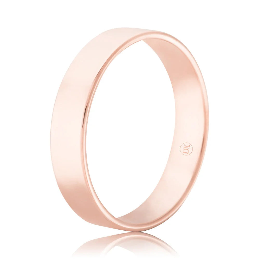 Simple rose gold band ring with a smooth, polished finish and a small hallmark inside the band.