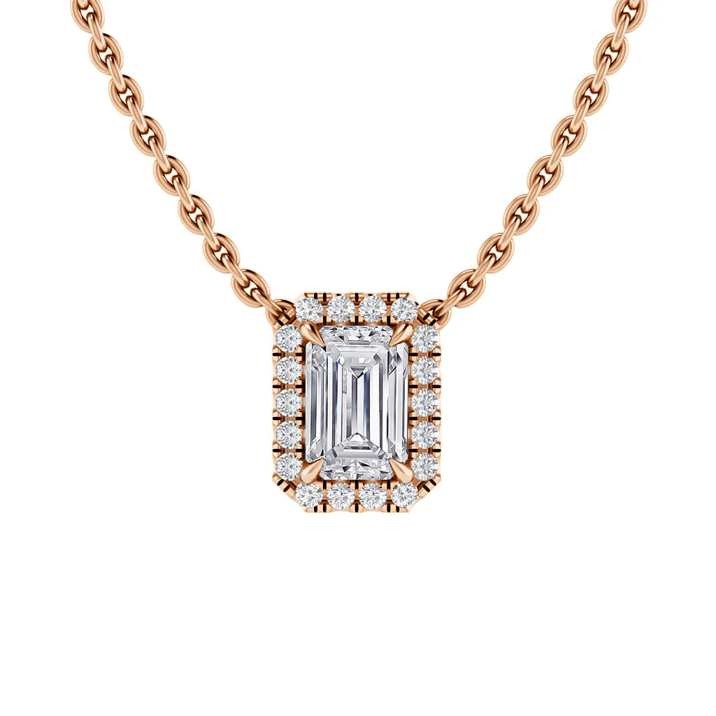 A gold necklace with a rectangular diamond pendant framed by small round diamonds on a gold chain.