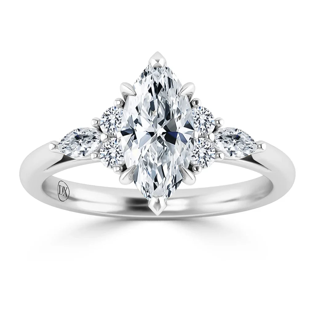 A marquise-cut diamond ring with smaller round and marquise side diamonds on a polished silver band.