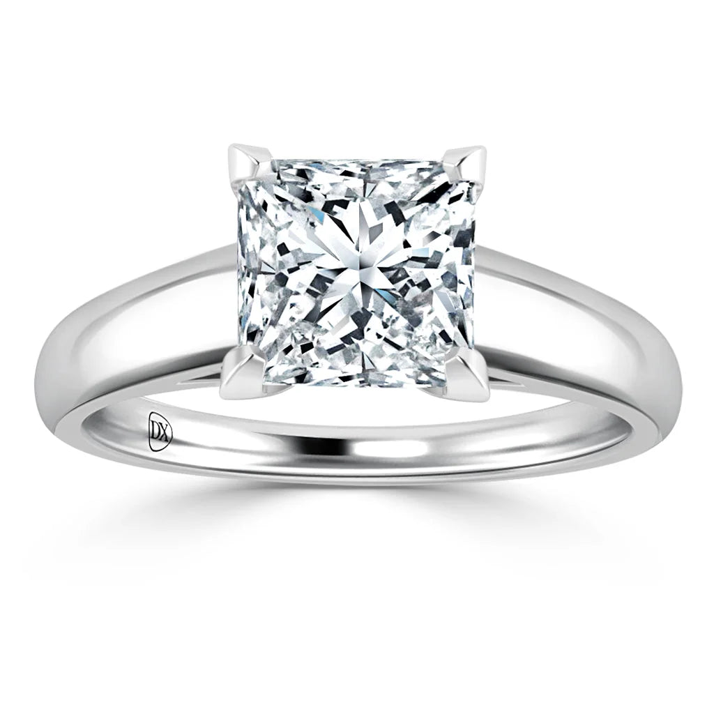 A solitaire engagement ring with a princess-cut diamond set on a polished white gold band.