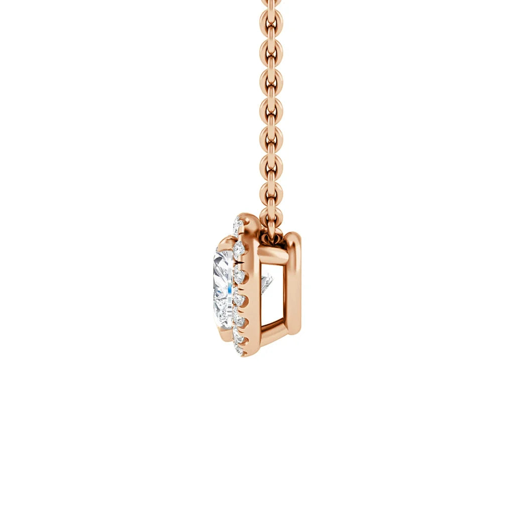 Rose gold necklace with a prong-set oval diamond pendant, shown from the side on a white background.
