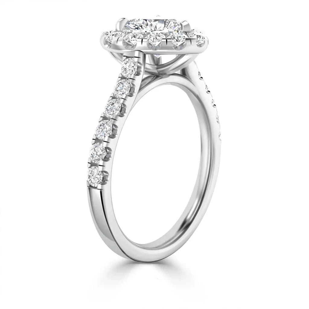 White gold ring with a round halo diamond center, diamond accents on the band, shown on a white background.