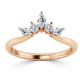 Rose gold ring with five white diamonds in varying shapes arranged in a crown-like cluster on top.