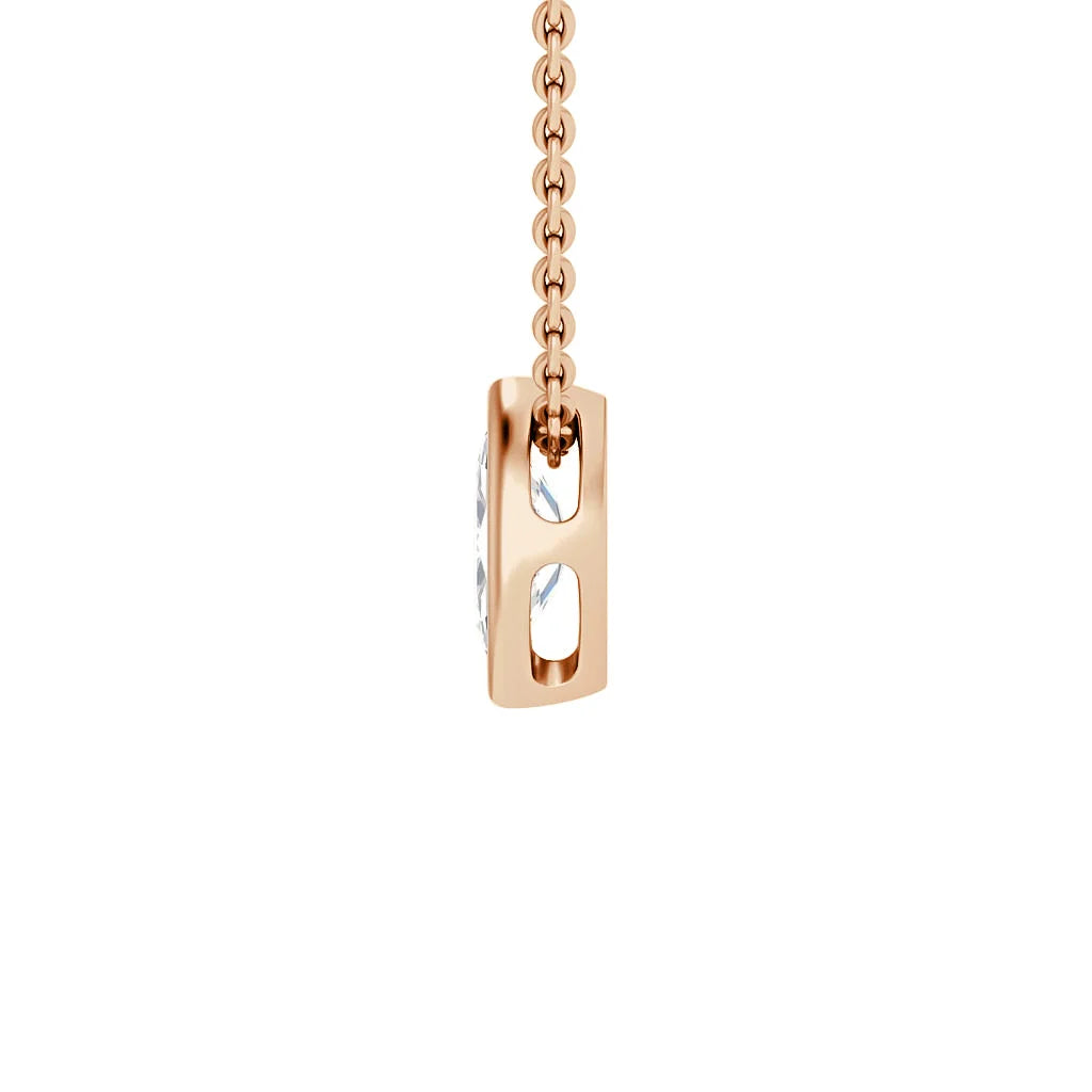 A rose gold pendant necklace with open sides, revealing three clear gemstones set within the pendant.