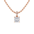 Rose gold chain necklace with a square diamond pendant and three small round diamonds above the main stone.