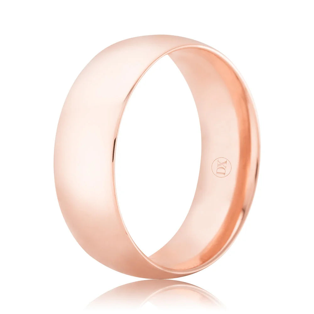 A plain, polished rose gold wedding band with a smooth, shiny surface and a small interior hallmark.