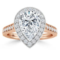Pear-shaped diamond ring with a double halo and rose gold band accented by small round diamonds.