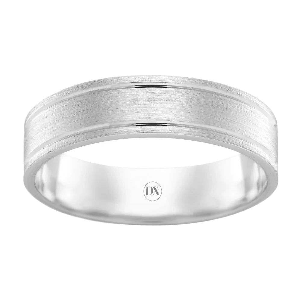 A brushed silver ring with a polished center groove and DX engraved inside the band.