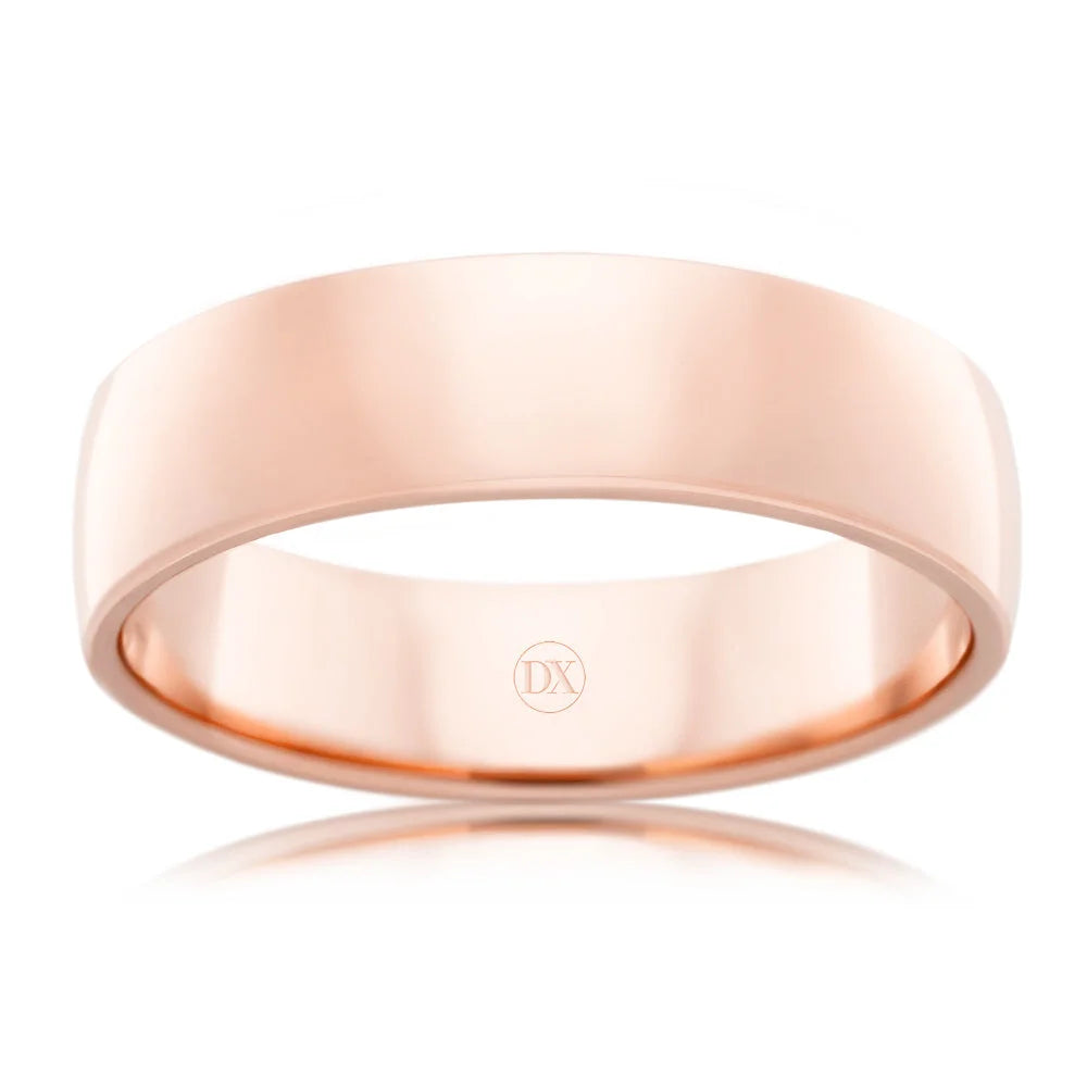 A plain, polished rose gold ring with a smooth surface and subtle engraving inside the band.