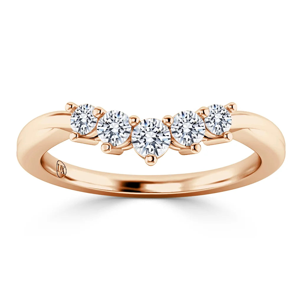 A rose gold ring with five round, white diamonds set in a row across the band.