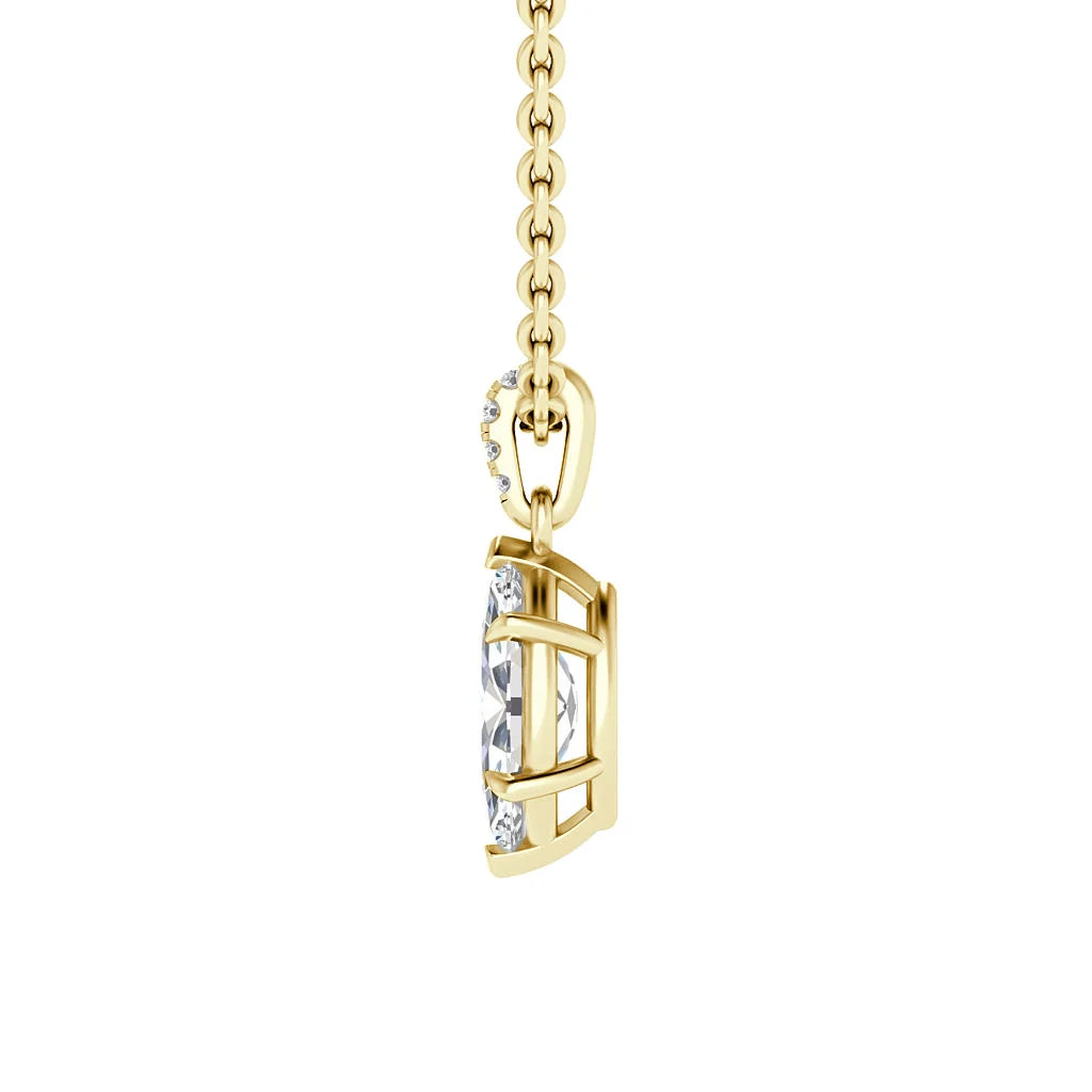 A gold necklace chain with a side view of a geometric pendant holding a clear, faceted gemstone.