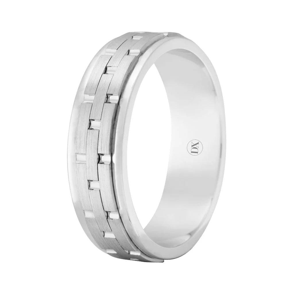 A silver men’s ring with a brushed finish and a grooved, interlocking rectangular pattern around the band.