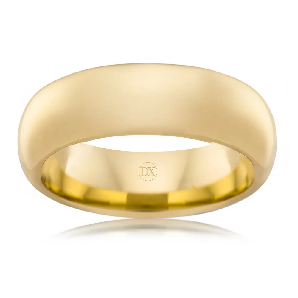 A plain, polished yellow gold wedding band with a smooth finish and the letters DX engraved inside.