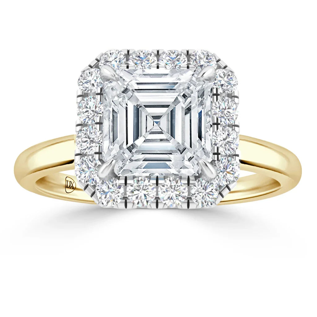 Asscher-cut diamond ring with a halo of round diamonds on a yellow gold band, viewed from the front.