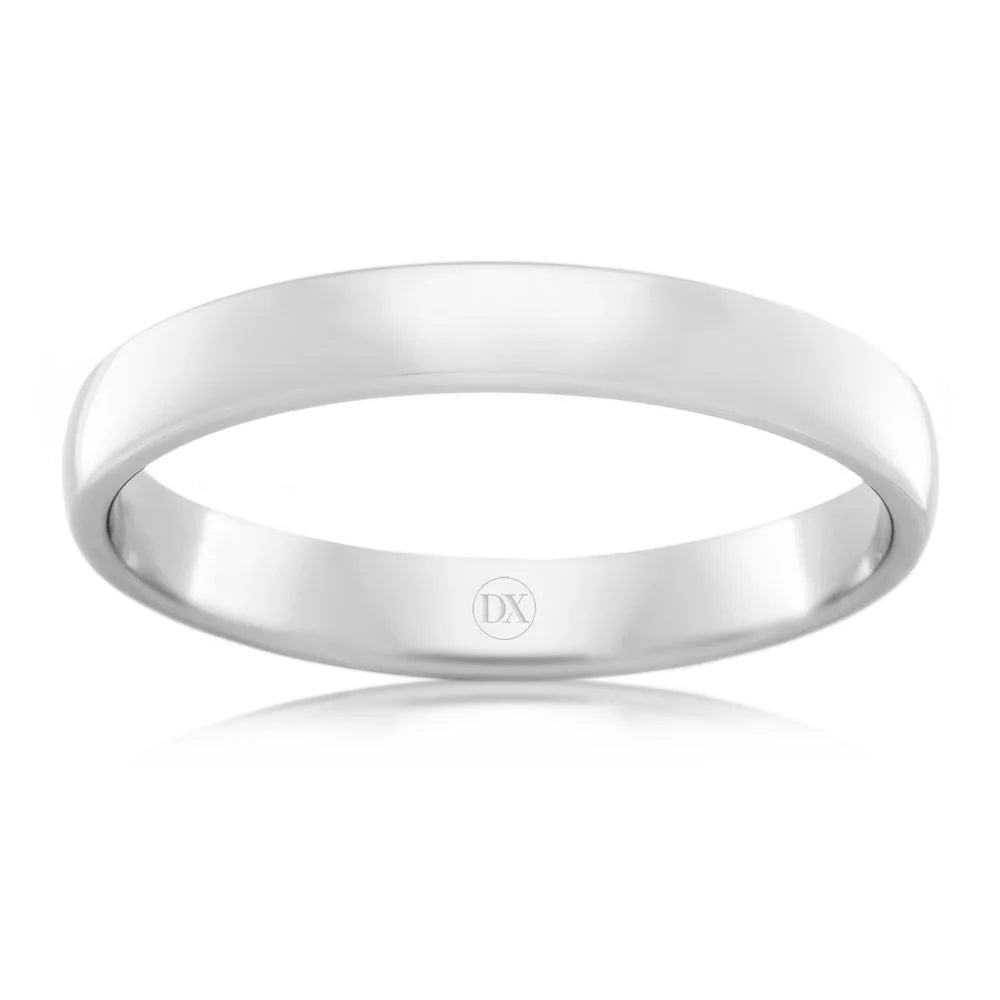 Simple, polished silver band ring with a smooth, shiny surface and DX engraved inside.