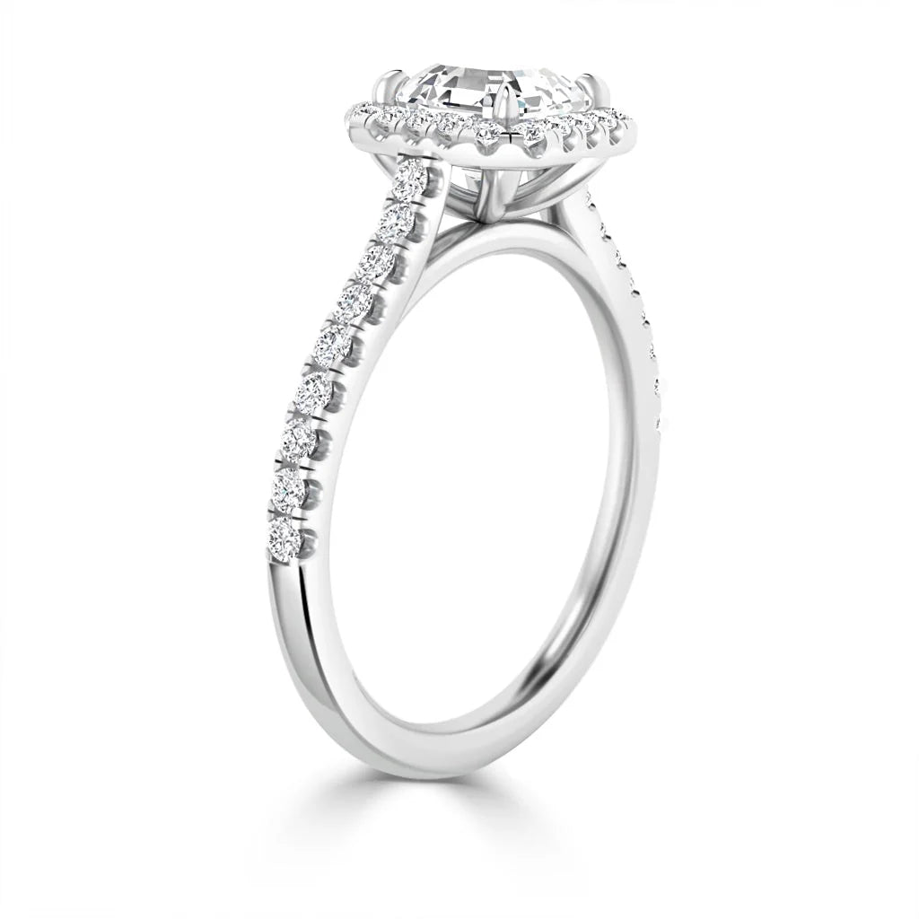 A white gold ring with a large round diamond center and a band set with smaller diamonds, viewed from the side.