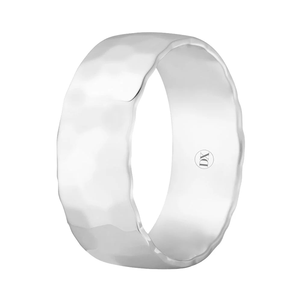 A wide, silver ring with a hammered texture and a small engraved logo inside the band.