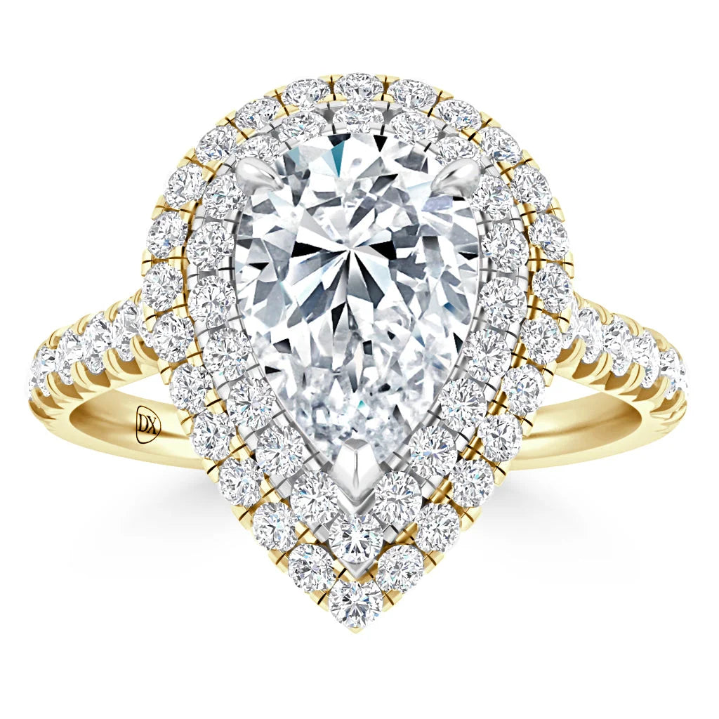 Gold ring with a large pear-shaped diamond, surrounded by two halos of smaller round diamonds on the band.