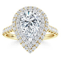 Gold ring with a large pear-shaped diamond, surrounded by two halos of smaller round diamonds on the band.