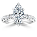 A marquise-cut diamond ring with a band featuring round diamonds set in white gold.