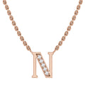 Rose gold chain necklace with a letter N pendant, partly adorned with small sparkling diamonds.