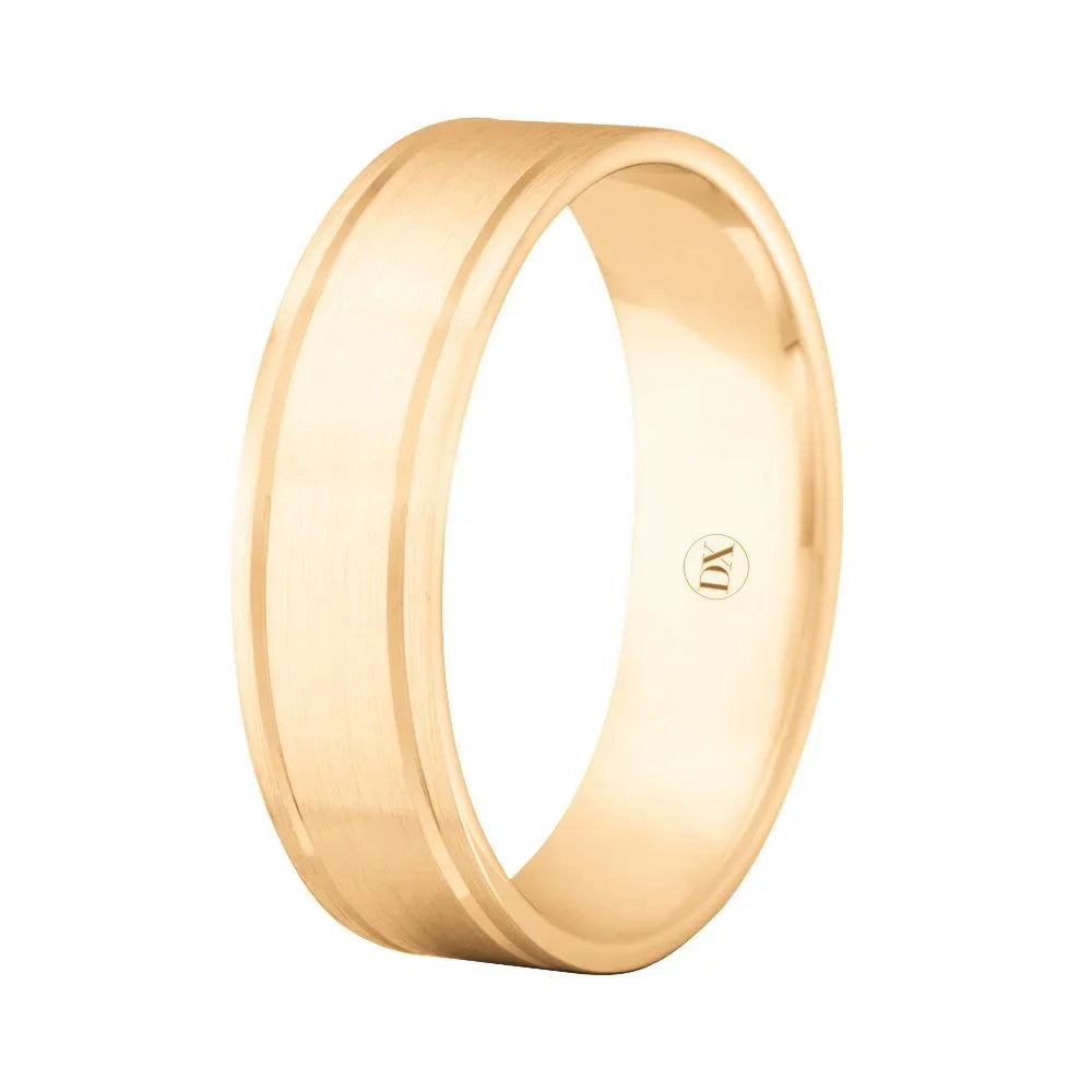 A simple gold wedding band with a matte center stripe and a polished beveled edge on a white background.