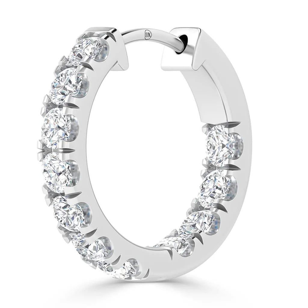 A white gold hoop earring featuring round, sparkling diamonds set along the outer edge.