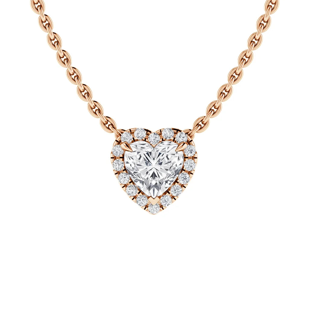 Rose gold chain necklace with a heart-shaped diamond pendant surrounded by smaller round diamonds.