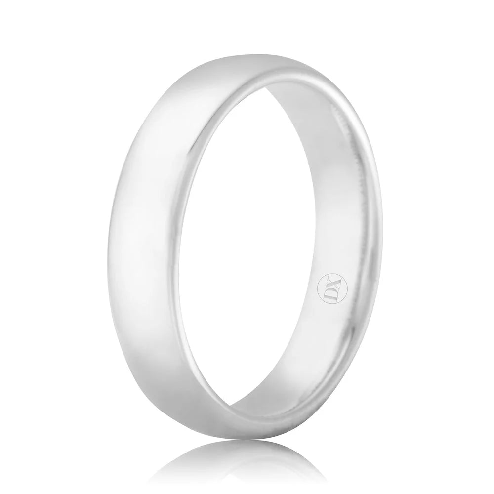 Simple, polished silver band ring with a smooth surface and a small engraved symbol inside.