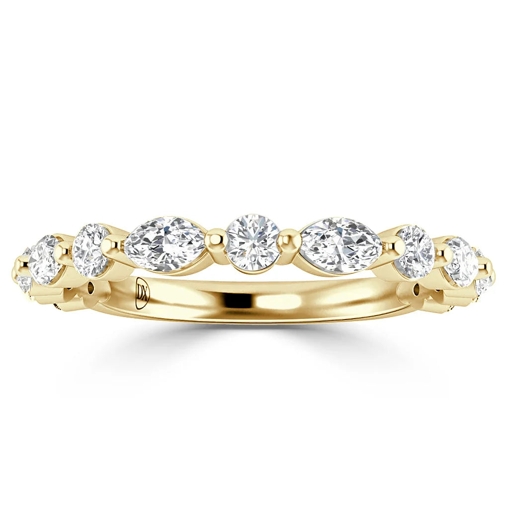 Gold ring featuring alternating round and marquise-cut diamonds set in a continuous pattern around the band.