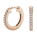 Rose gold hoop earrings with a row of small round white gemstones on the front.