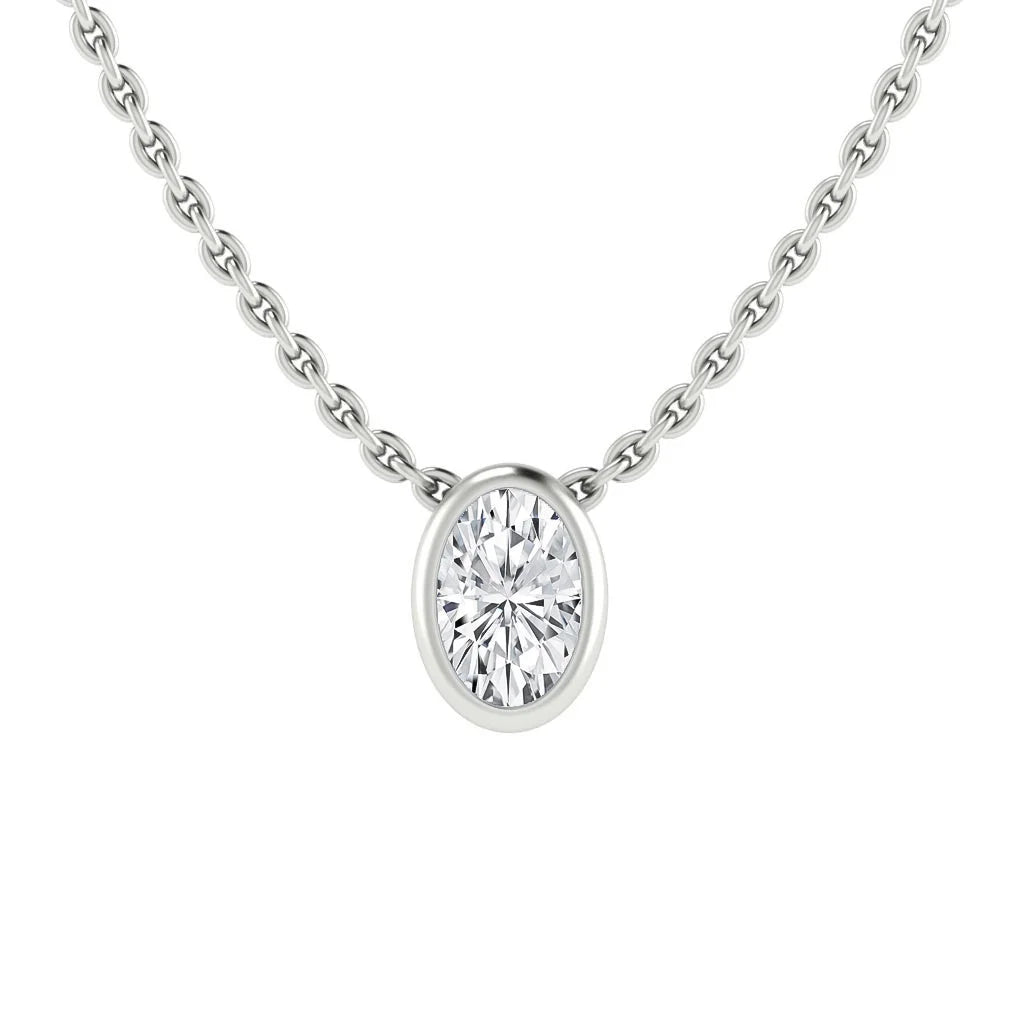 Close-up of a silver chain necklace with an oval-shaped diamond pendant in a simple bezel setting.