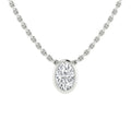 Close-up of a silver chain necklace with an oval-shaped diamond pendant in a simple bezel setting.