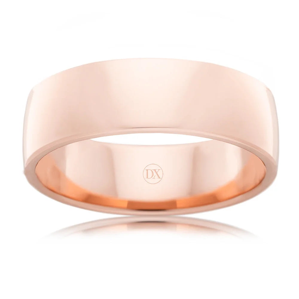 A simple, polished rose gold band ring with a smooth finish and subtle DX engraving inside.