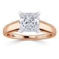 Rose gold ring with a large princess-cut diamond in a white gold four-prong solitaire setting.