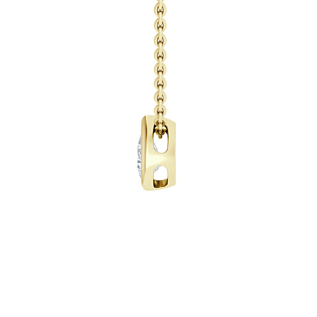 Gold chain with a rectangular gold pendant featuring two oval cutouts, viewed from the side on a white background.