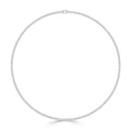 A delicate, circular diamond tennis necklace with small, evenly spaced diamonds set in white metal.