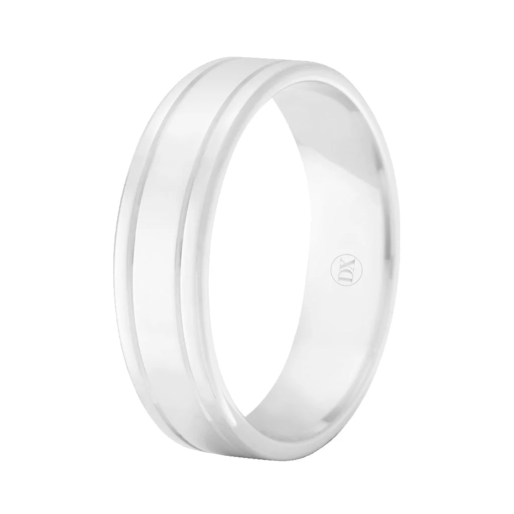 A simple silver ring with a single engraved line around its center on a white background.