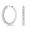 White gold hoop earrings encrusted with round diamonds, shown from the side and front on a white background.