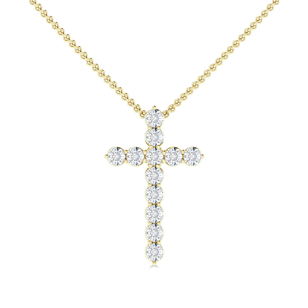 Gold beaded chain necklace with a cross pendant made of round, sparkling clear gemstones.