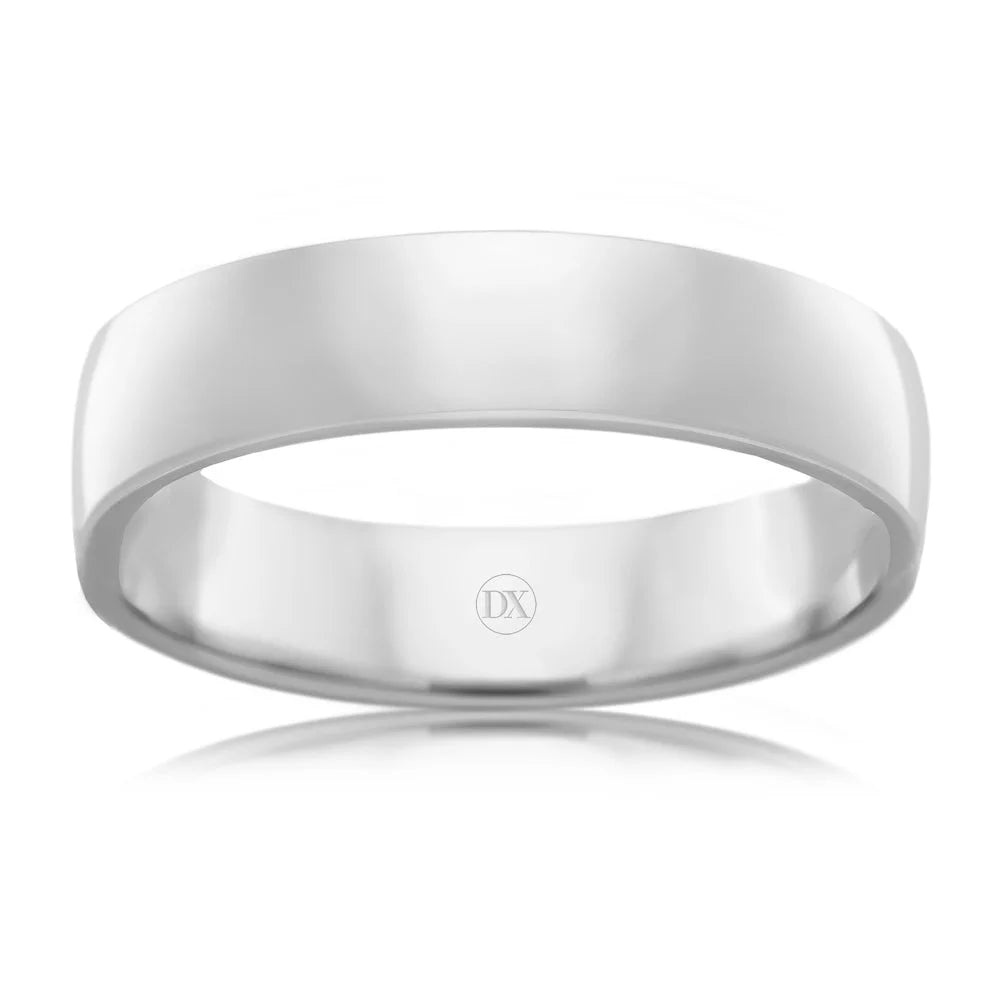 A plain, polished silver band ring with a smooth surface and a small DX engraving inside.