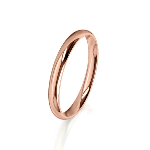 A simple, polished rose gold band ring is displayed on a white background.