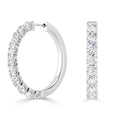 Two white gold hoop earrings, each encrusted with a row of sparkling round-cut diamonds.